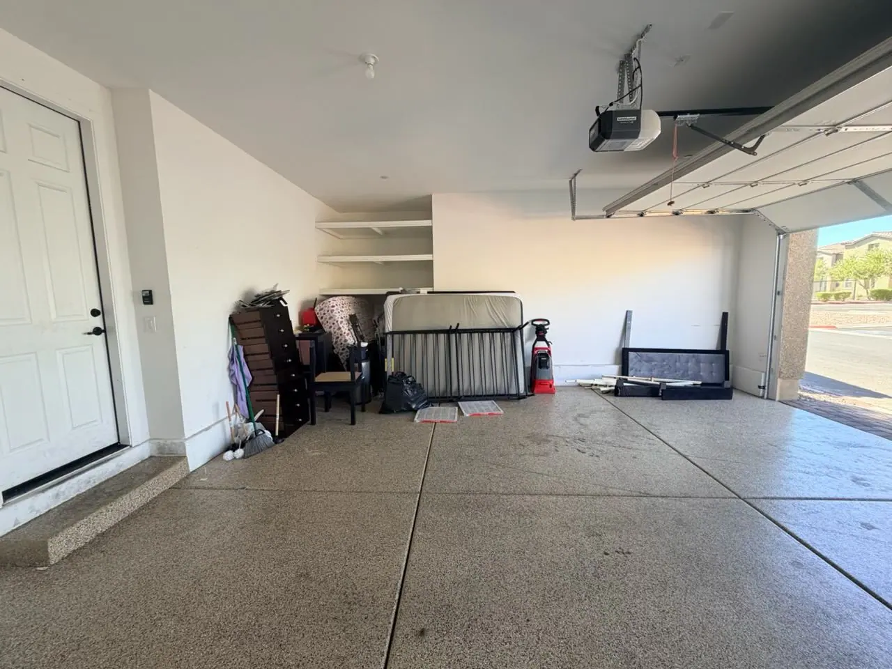 Henderson garage packed with furniture and belongings before removal