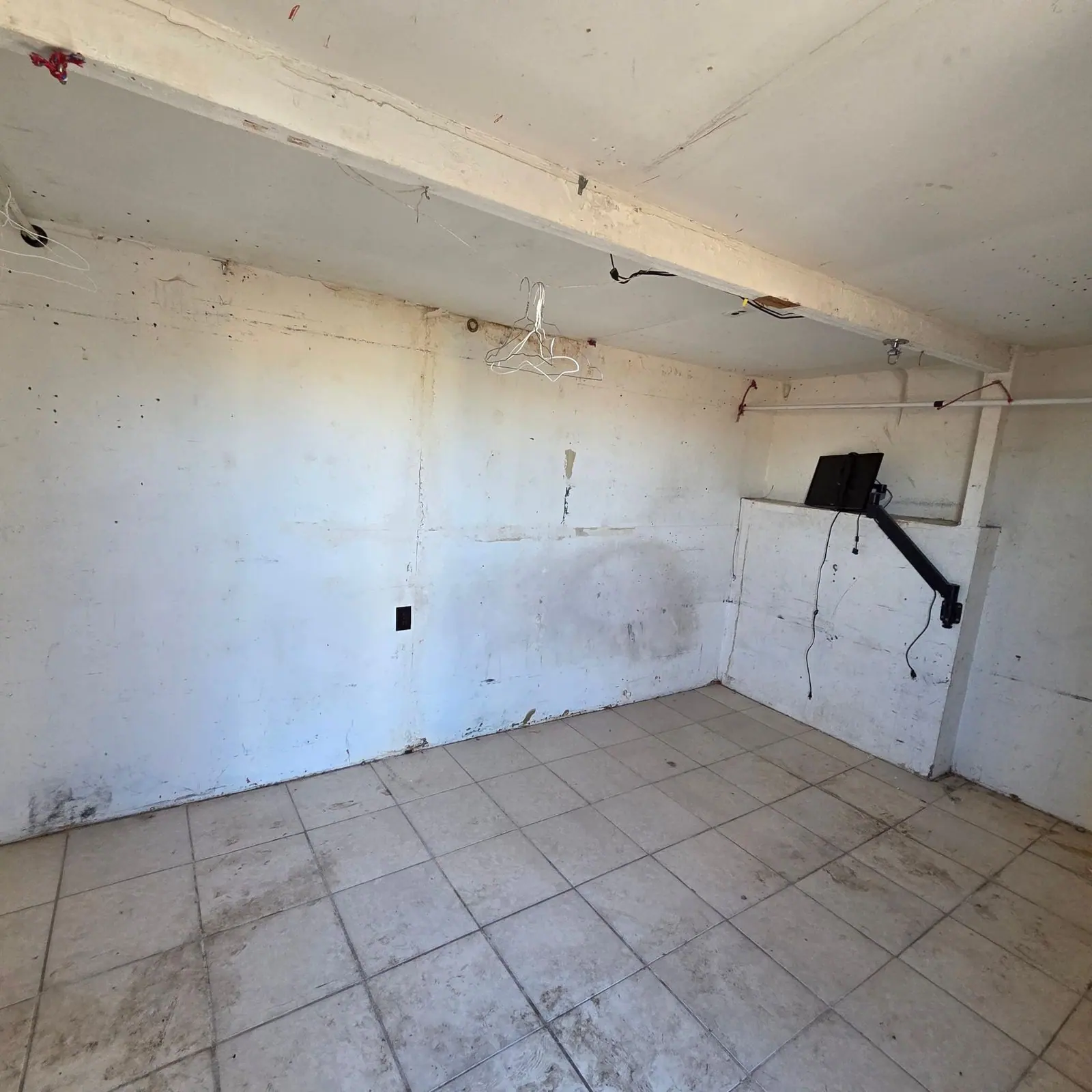 Same room emptied down to bare walls and tile floor after a hoarding cleanout by Henderson Junk Solutions