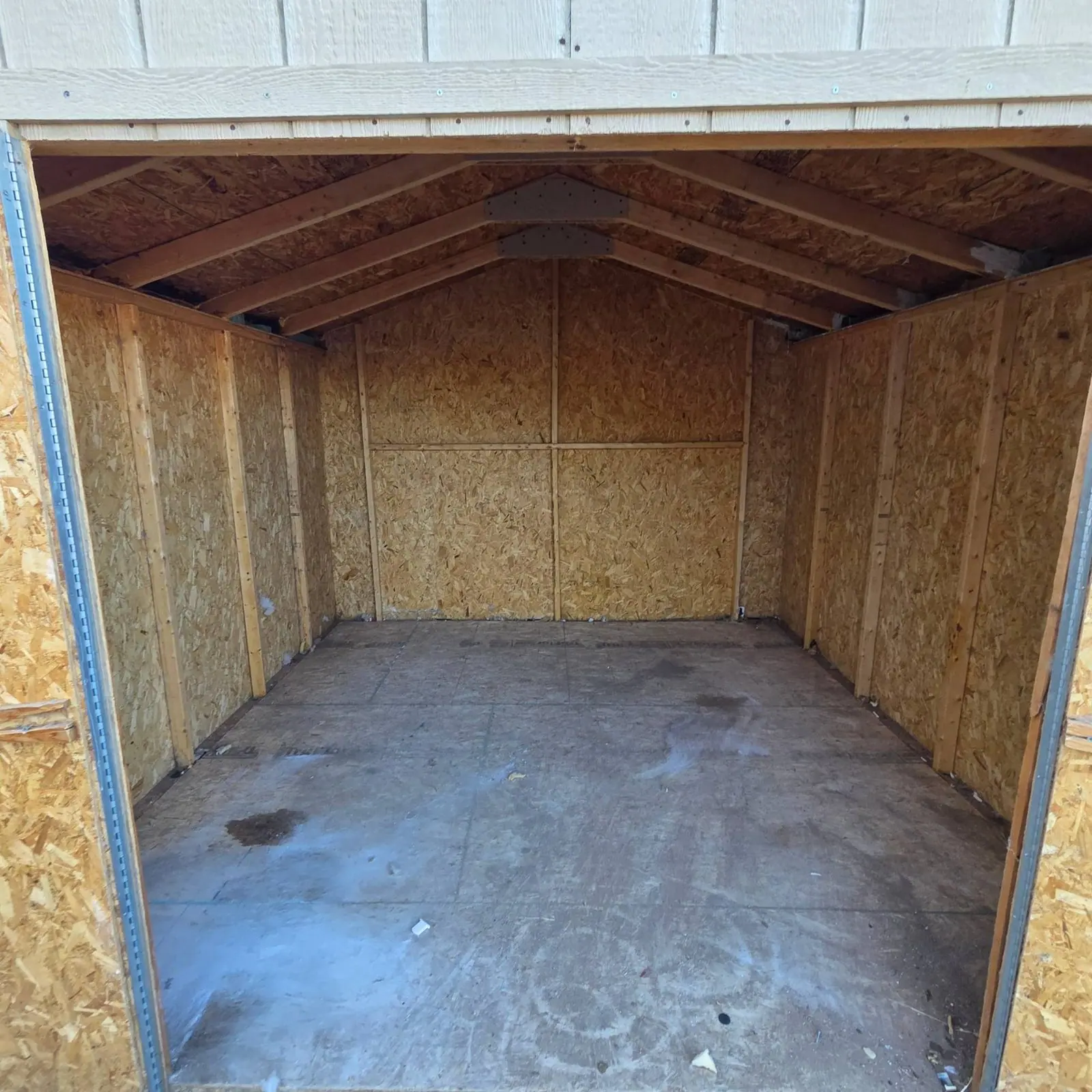 Empty wood shed swept clear after a hoarding cleanout near Cadence in Henderson, NV